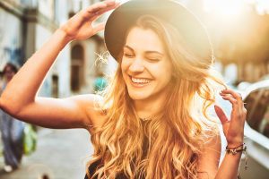 A young woman smiling with a beautifully whitened smile.